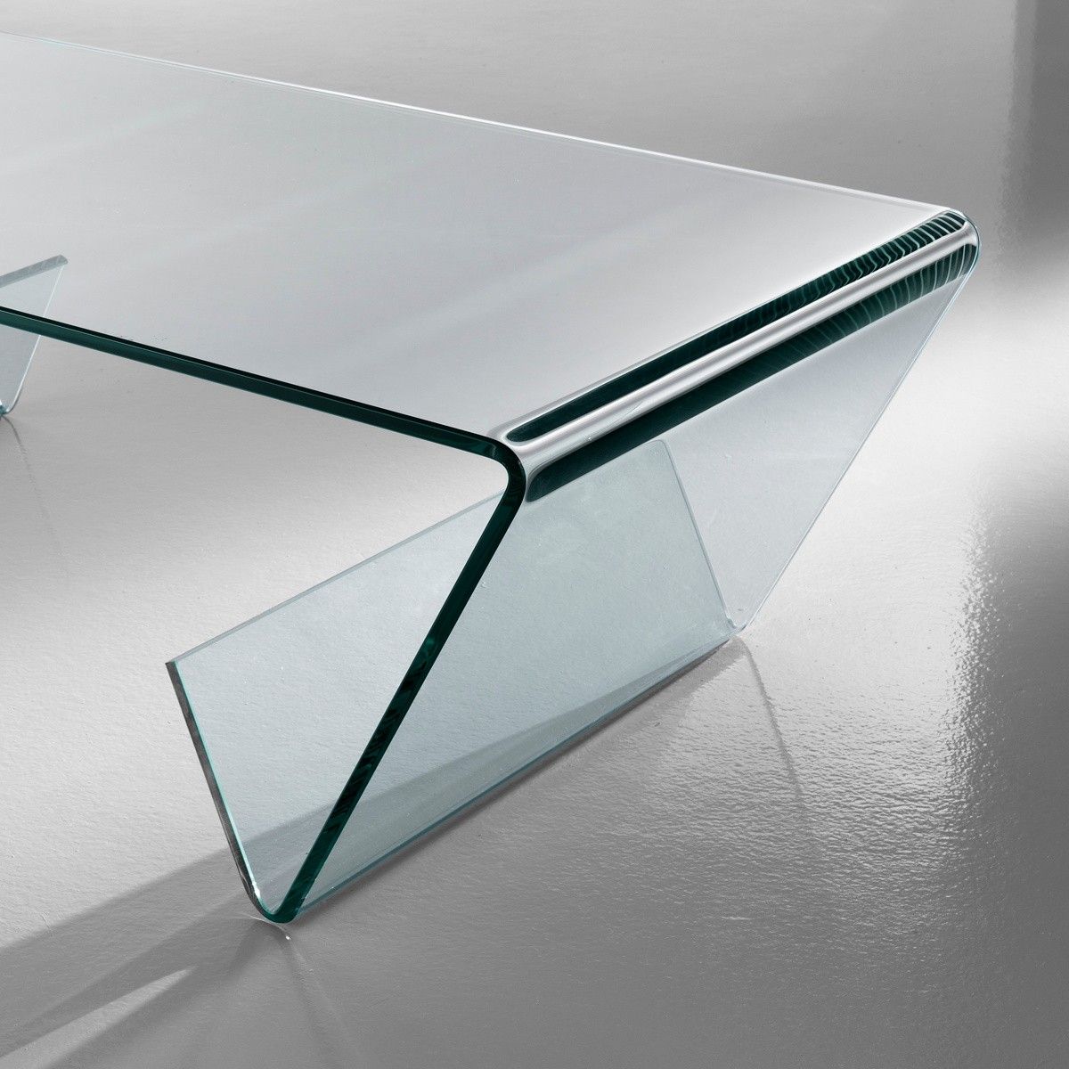 Tavolino gabry in vetro curvato con portariviste 110 x 55 cm